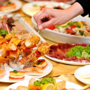 Human taking food on the party Human taking food on the party